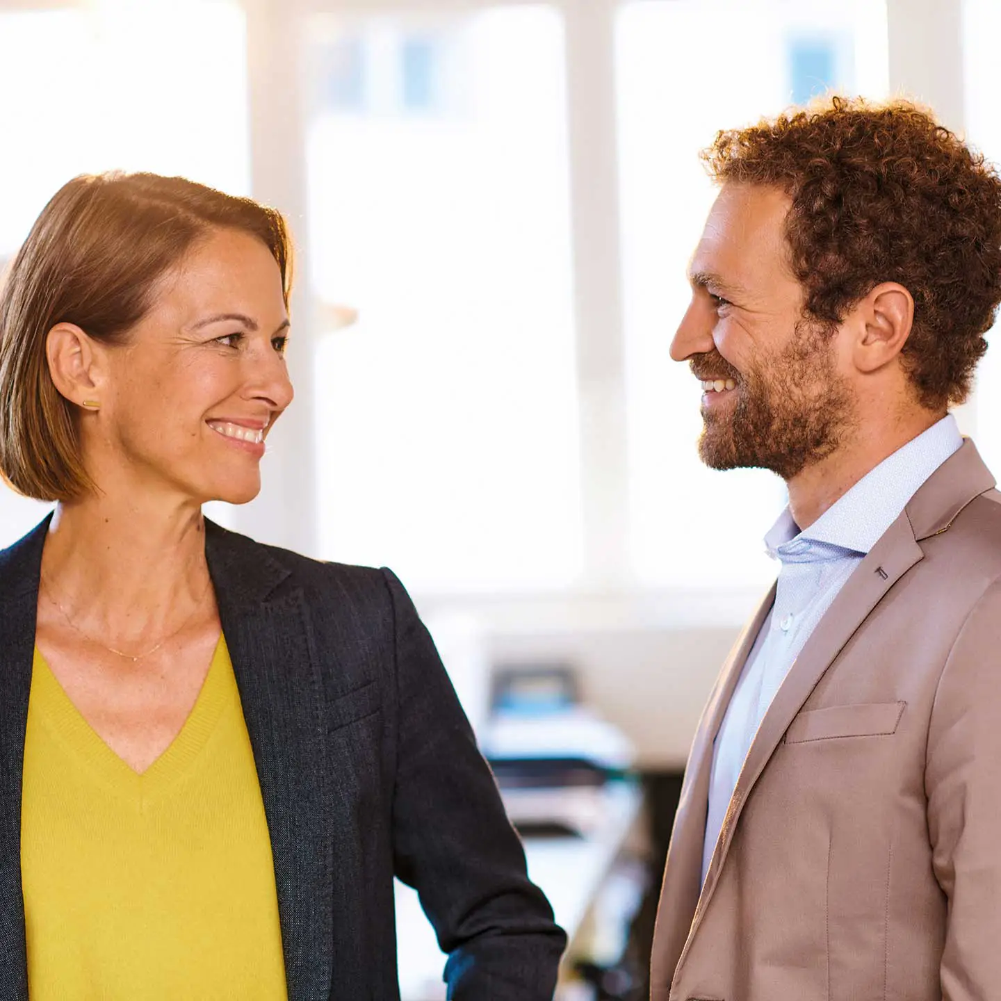 Businesswoman and businessman with a friendly smile